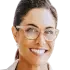 Portrait of Meg P., a brown-haired woman in her mid-30s, smiling happily