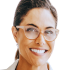 Portrait of Meg P., a brown-haired woman in her mid-30s, smiling happily